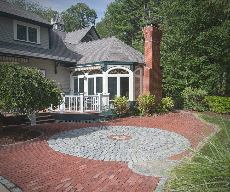 Brick patio with a granite cobblestone circle